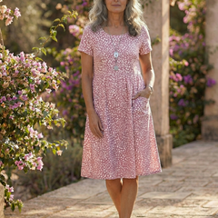 Meadow Drift dress in pink with white tiny dots, short sleeves, knee-length fit-and-flare