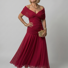 Off-shoulder flow maxi dress in red with draped sweetheart neckline and pleated skirt