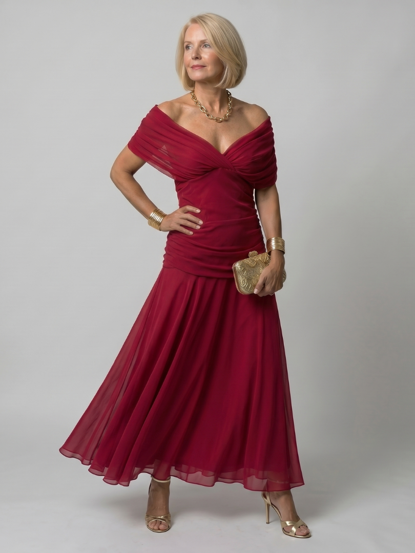 Off-shoulder flow maxi dress in red with draped sweetheart neckline and pleated skirt