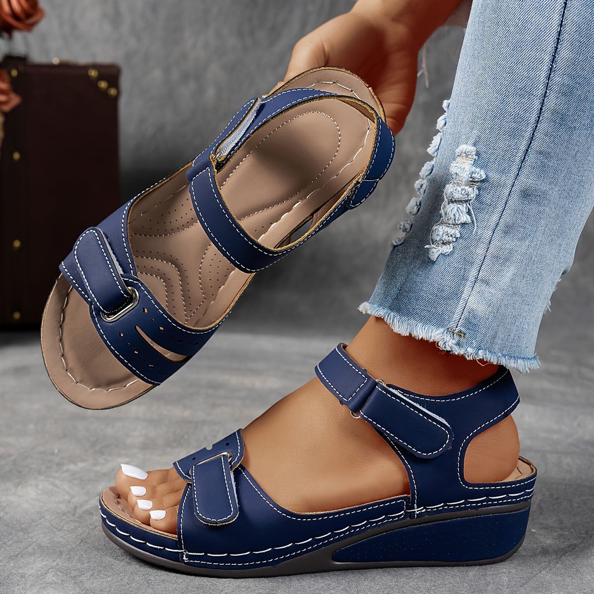 Navy leather open-toe sandals with two hook-and-loop straps and stitched platform sole