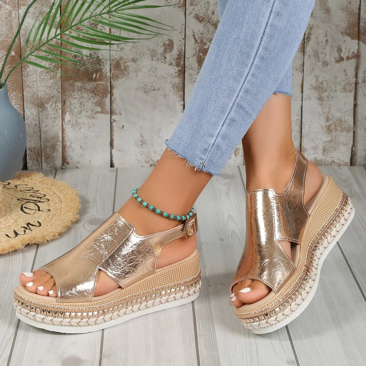 Silver metallic open-toe platform sandals with ankle strap buckle and braided jute-style edging