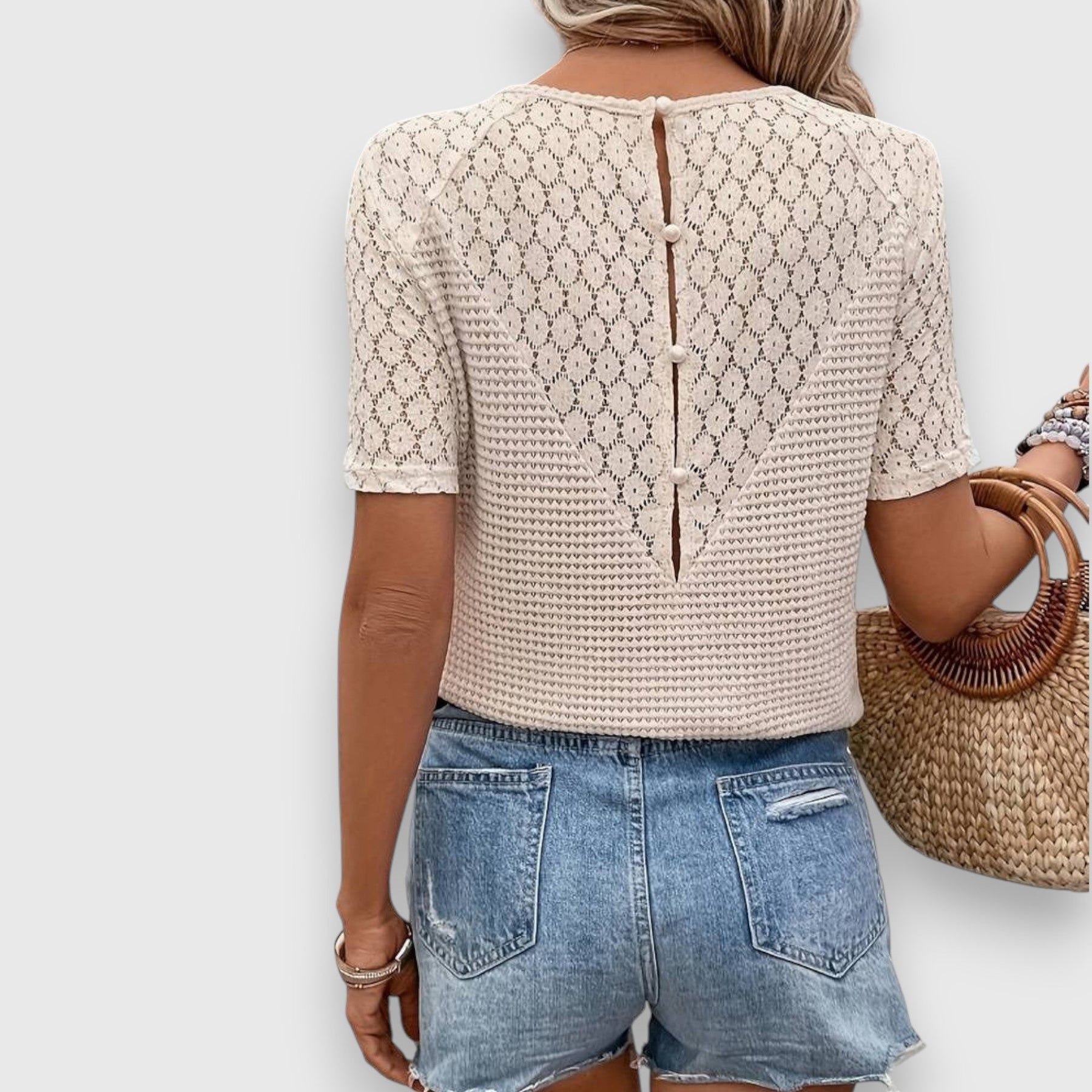 Emanie knit shirt back view with button placket and lace short sleeves, cream
