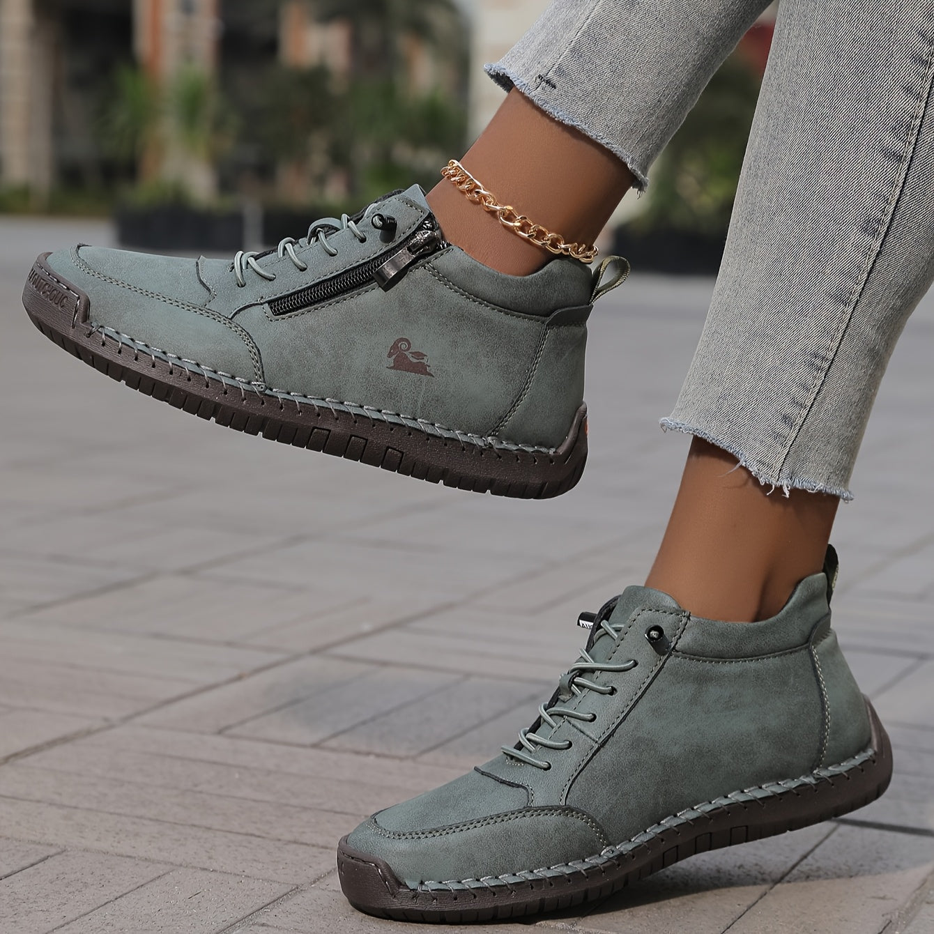 Gray zip-up comfort shoes, side zipper and patterned sole visible