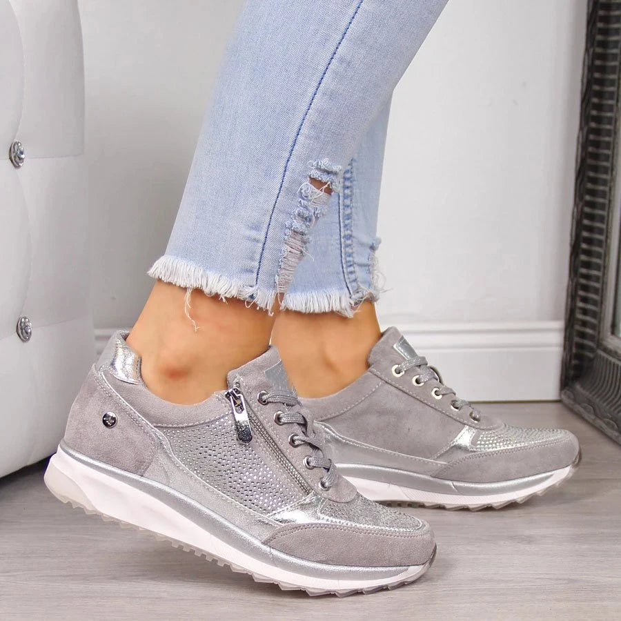Light grey metallic zip-up comfort sneakers with lace-up front and side zipper