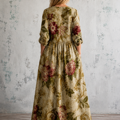 Floral summer dress back view with 3/4 sleeves and gathered waist in green tones