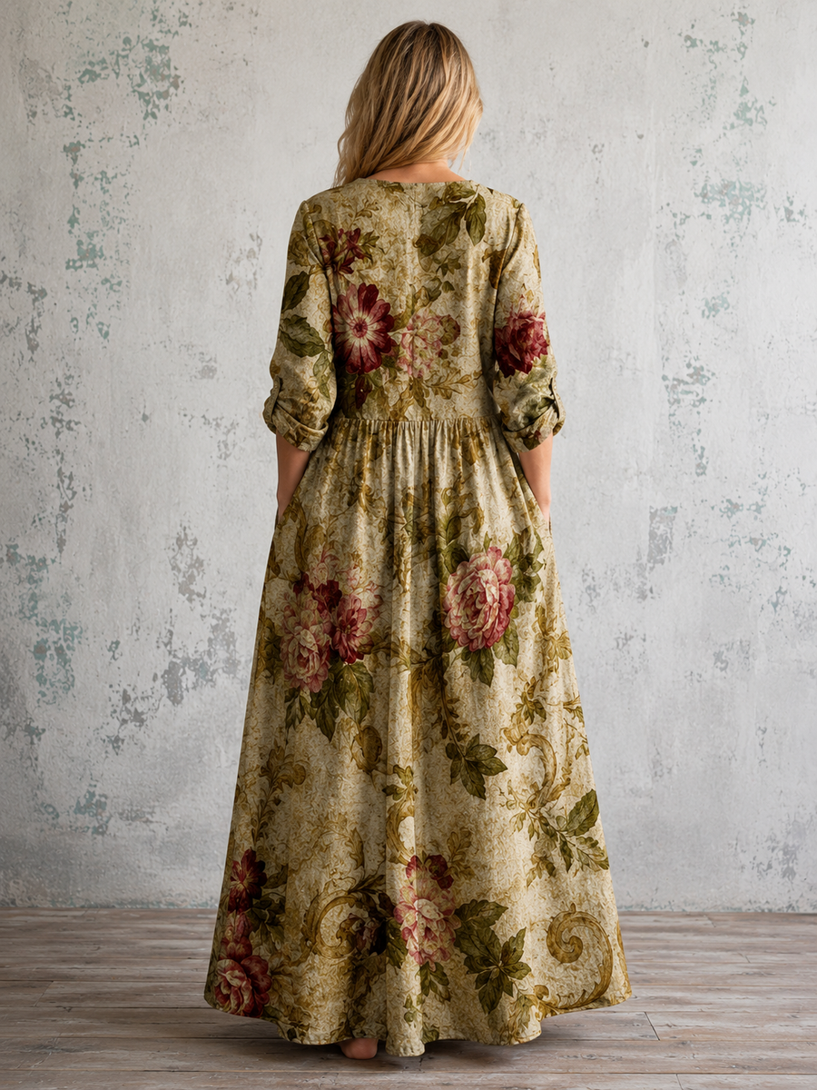 Floral summer dress back view with 3/4 sleeves and gathered waist in green tones