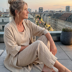 Beige relaxed three-piece set with scoop-neck top, wide-leg pants, and open jacket