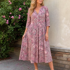 Pink floral midi dress with V-neck and three-quarter sleeves, gathered full skirt