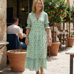 Sky blue V-neck tiered midi dress with short puff sleeves, small floral print