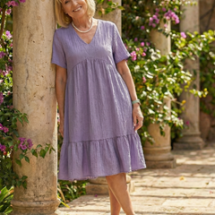 Purple woven ease dress with V-neck, short sleeves, and tiered skirt