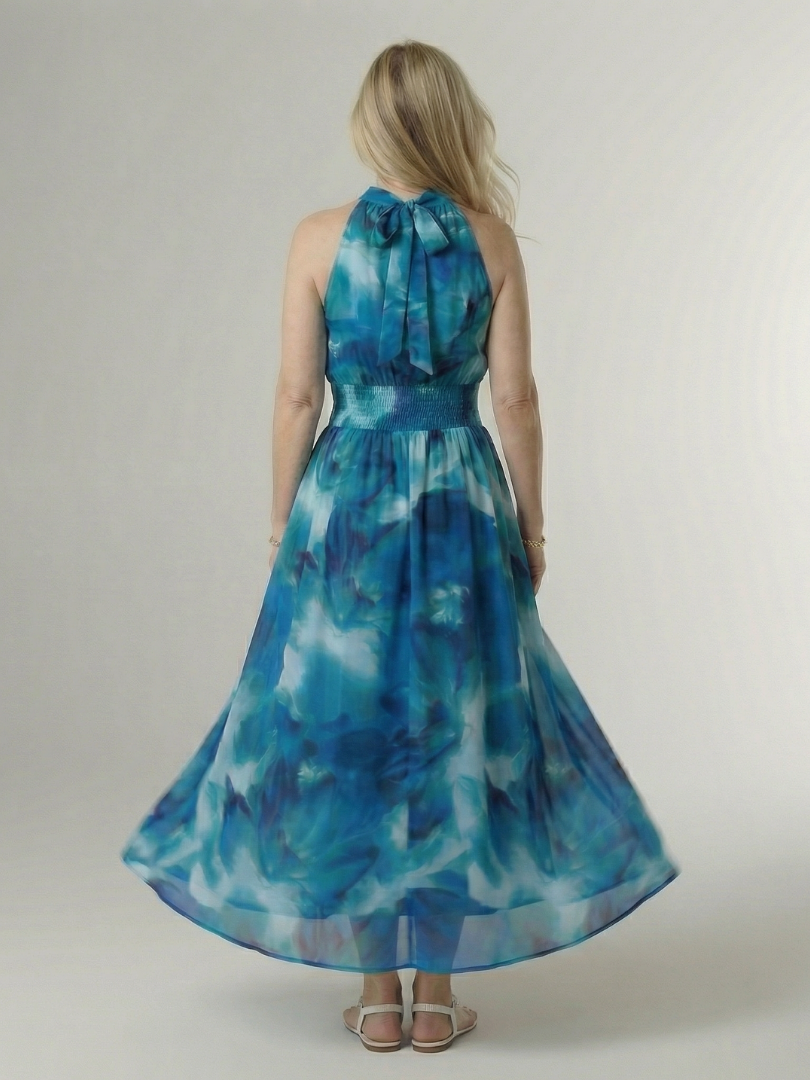 Blue gathered halter midi dress, back view, tie-neck and gathered waist
