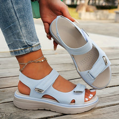 Light blue sandals with two hook-and-loop straps, open toe, and cushioned footbed