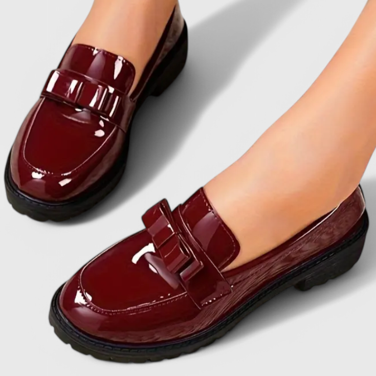 Red glossy loafers with chunky sole and front buckle strap detail