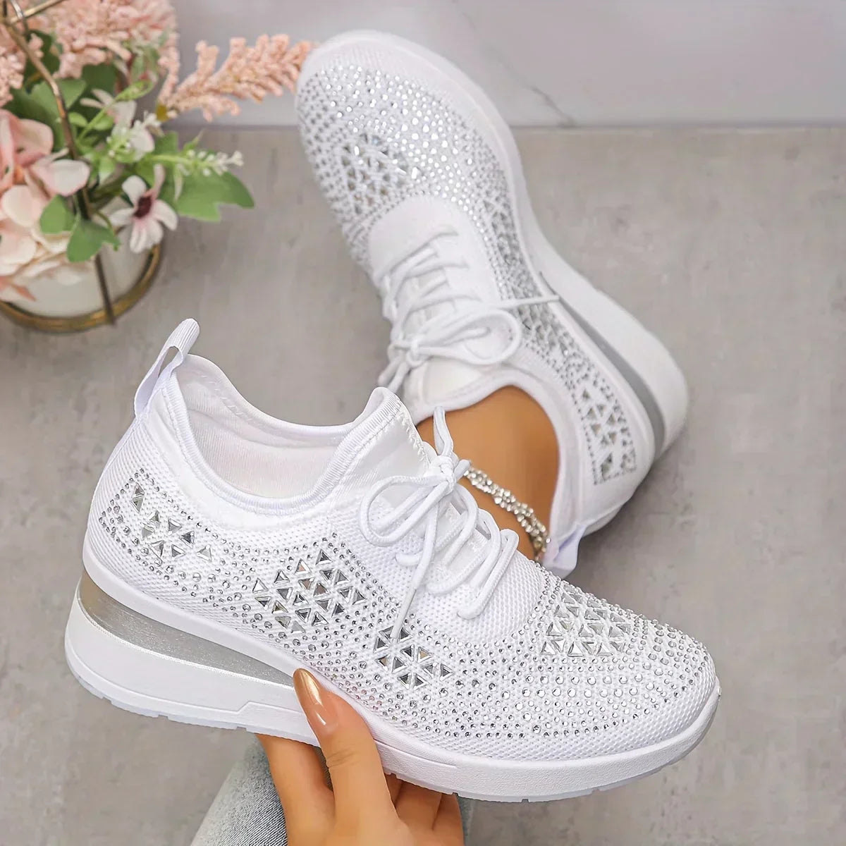 White knit lace-up sneakers with rhinestone trim and chunky white sole