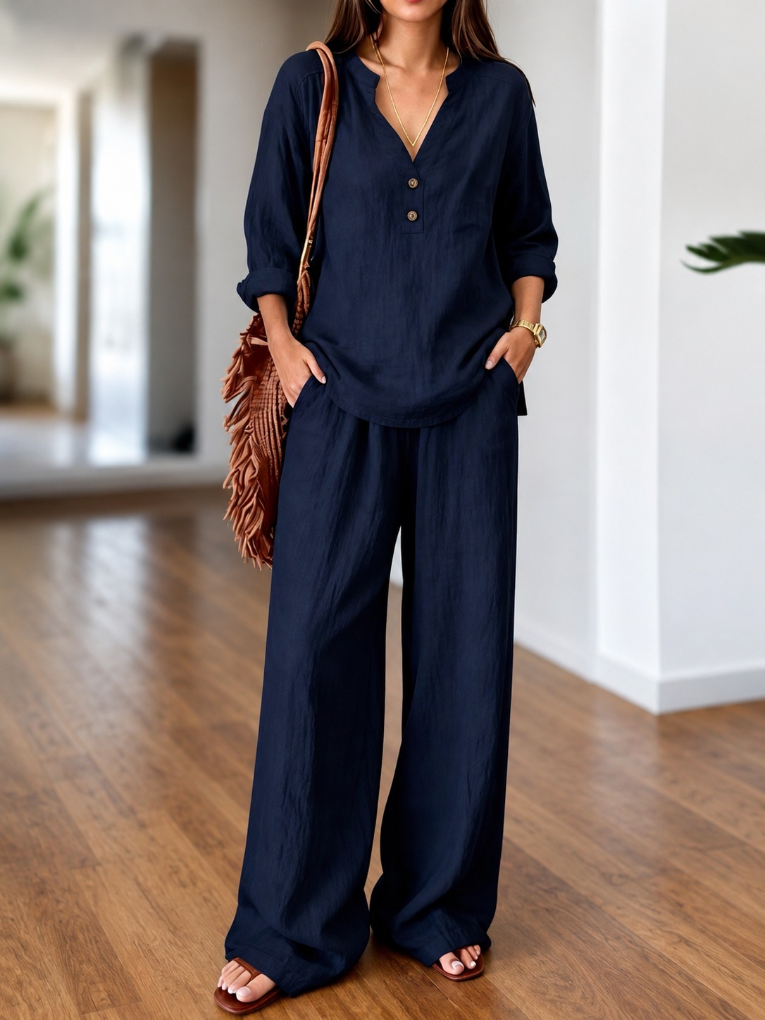 Navy long-sleeve two-piece set with V-neck tunic top and wide-leg pants