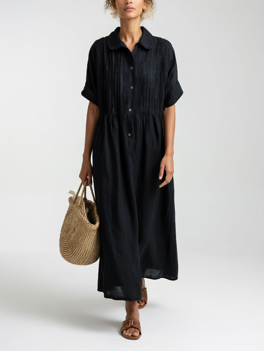 Black shirt dress with short sleeves, button front, and gathered waist, midi length