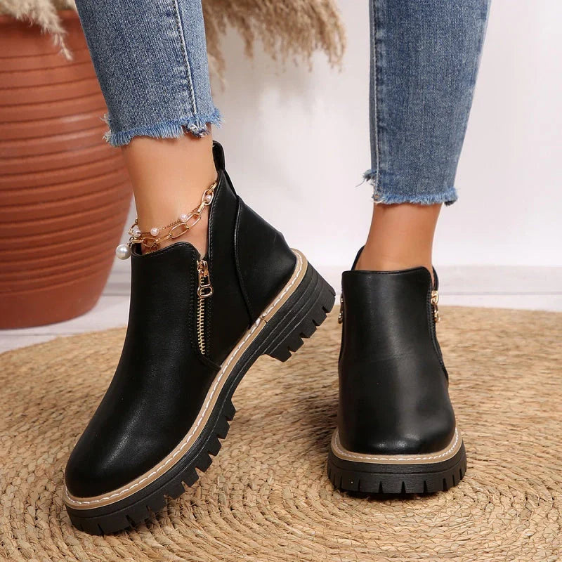Women's ankle boots, smooth black with side zipper, ankle height, chunky lug sole.