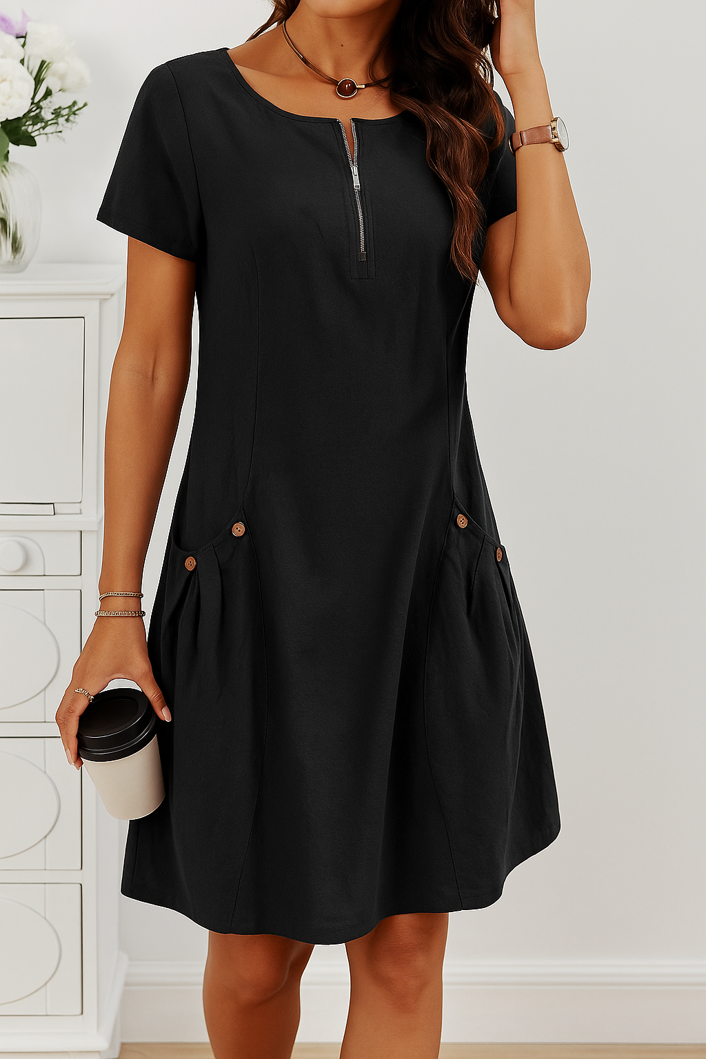 Black zip-front midi dress with short sleeves and button accents at the sides