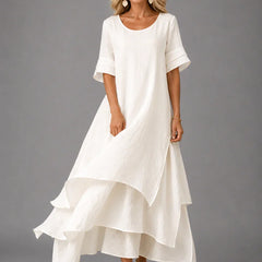 White cotton ruffle midi dress with short sleeves and tiered flared hem
