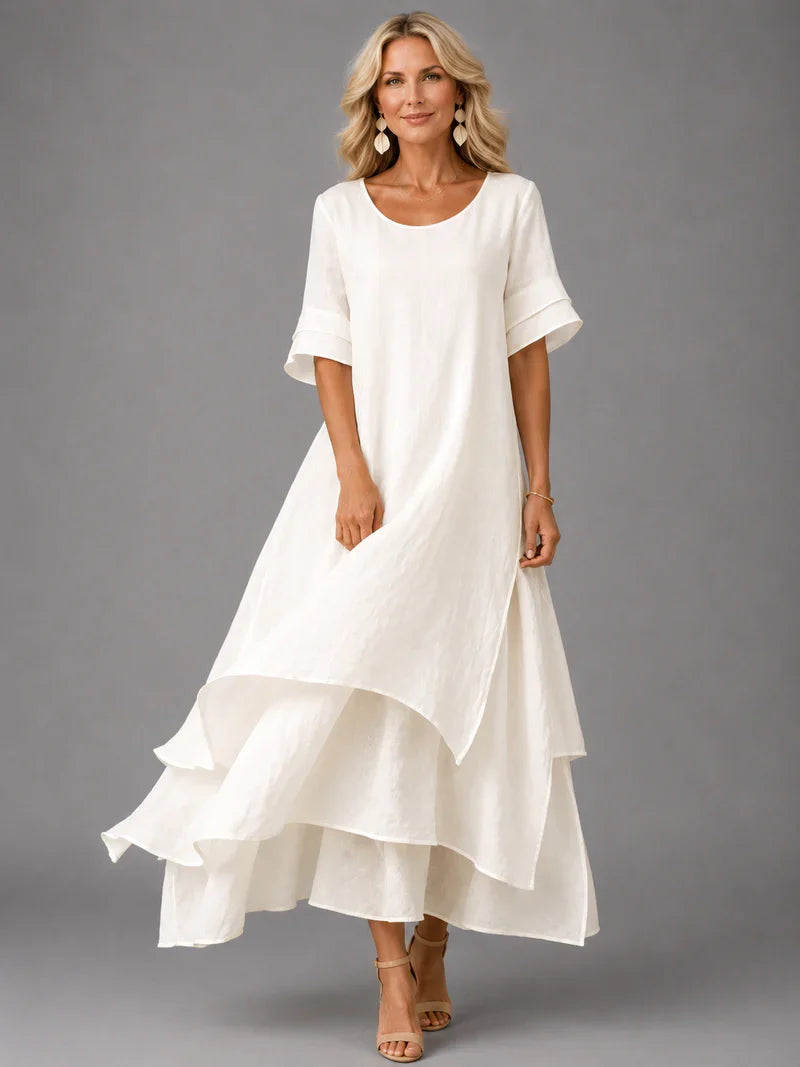 White cotton ruffle midi dress with short sleeves and tiered flared hem