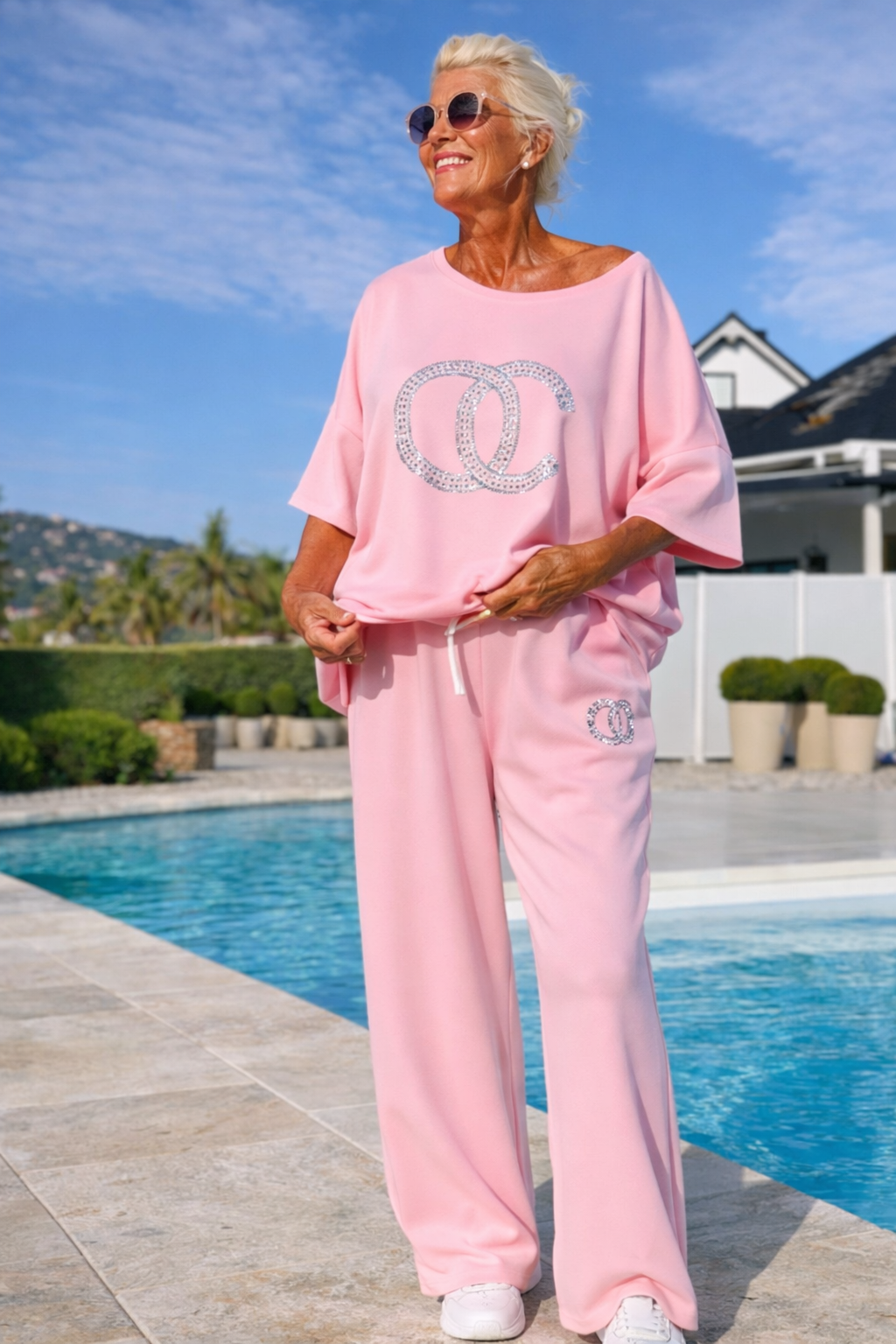 Pink two-piece lounge set with loose crew T-shirt and drawstring wide-leg pants
