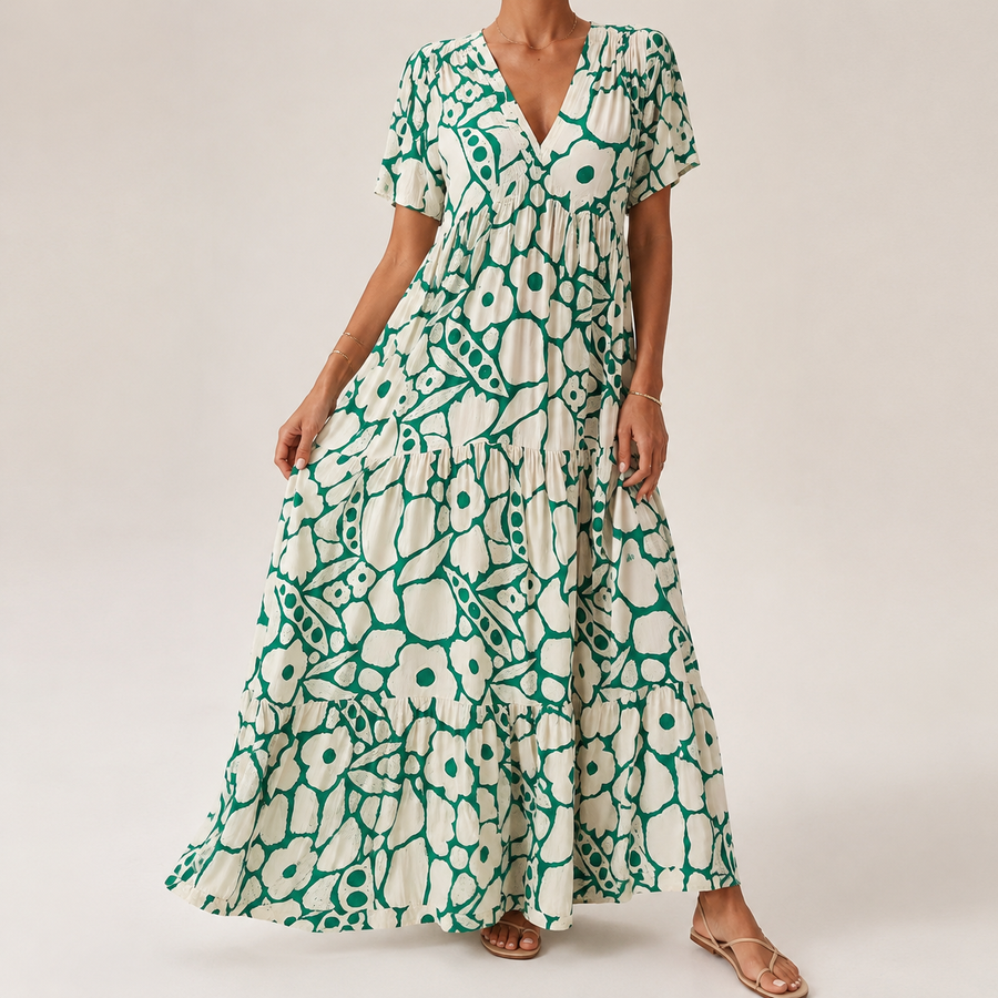Green-and-white tiered midi bohemian dress with short sleeves and bold circular print