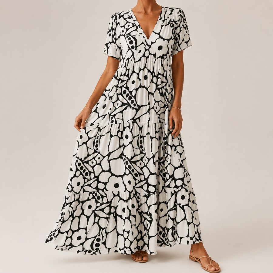 Black-and-white tiered midi bohemian dress with short sleeves and bold circular print