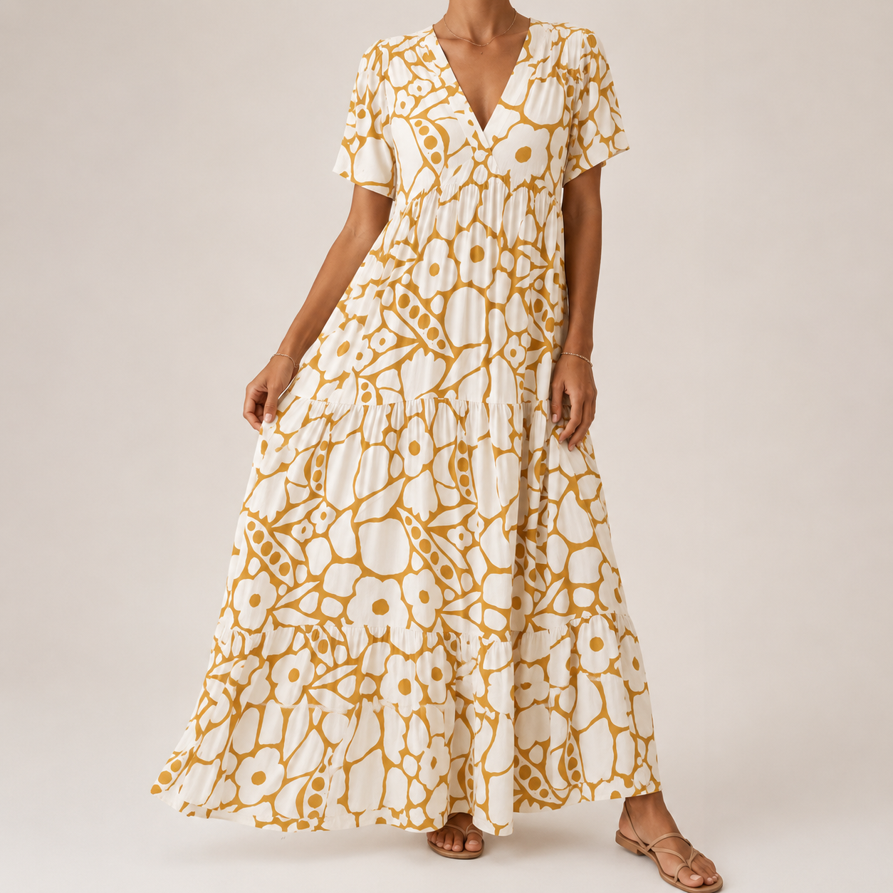 Orange-and-white tiered midi bohemian dress with short sleeves and bold circular print