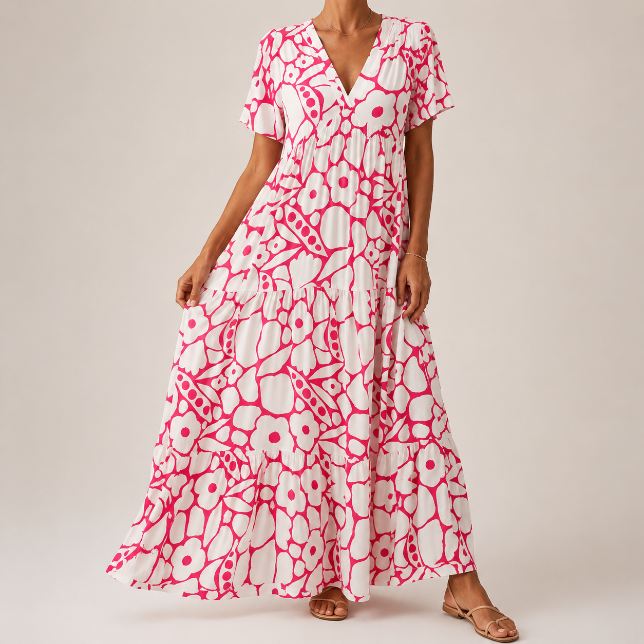 Pink-and-white tiered midi bohemian dress with short sleeves and bold circular print