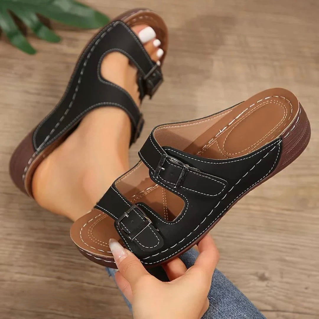 Black open-toe platform sandals with two adjustable buckle straps
