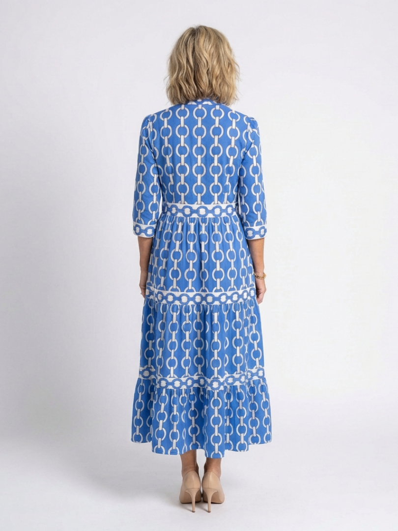 Blue chain-link pattern midi dress with 3/4 sleeves, tiered back and ruffled hem