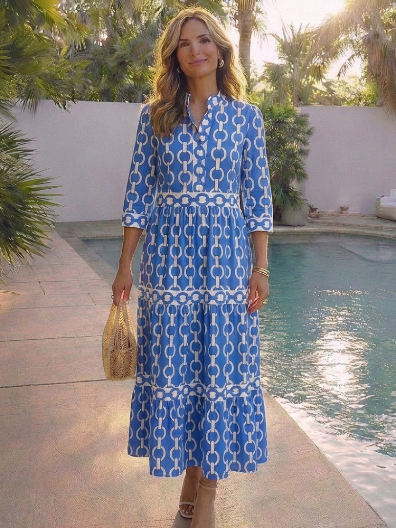 Blue chain-link pattern midi dress with 3/4 sleeves and tiered skirt