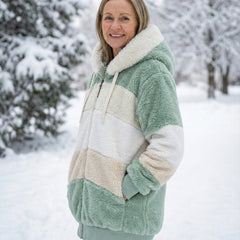 Colorblock plush zip-up hoodie jacket, side view in sage green and cream color blocks