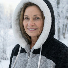 Colorblock plush jacket hood with white drawstrings and zip front; black and gray panels