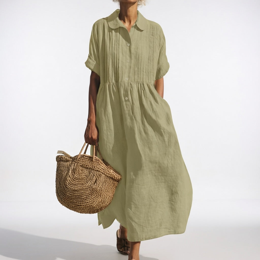 Light green shirt dress with short sleeves, button front, and gathered waist, midi length