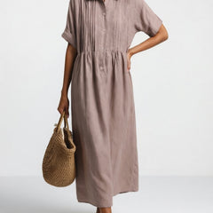 Khaki shirt dress with short sleeves, button front, and gathered waist, midi length