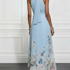 Light blue halter maxi dress with neck bow and floral print hem