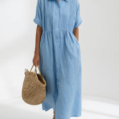 Light blue shirt dress with short sleeves, button front, and gathered waist, midi length