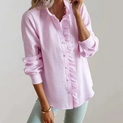 Light pink ruffle-front blouse with button placket and long sleeves, front view