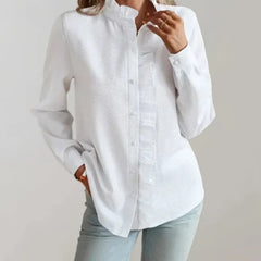White ruffle-front blouse with button placket, high collar, long sleeves