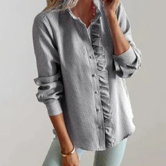 Grey ruffle-front button-up blouse with long sleeves and stand collar detail