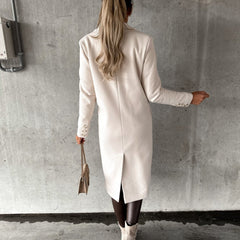 Cream long coat back view with long sleeves and center seam