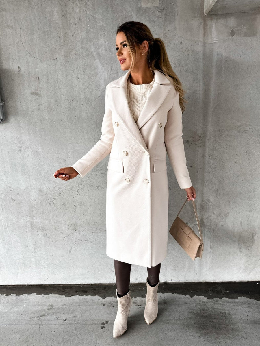 Cream long coat with notched lapel, double-breasted buttons, side flap pockets