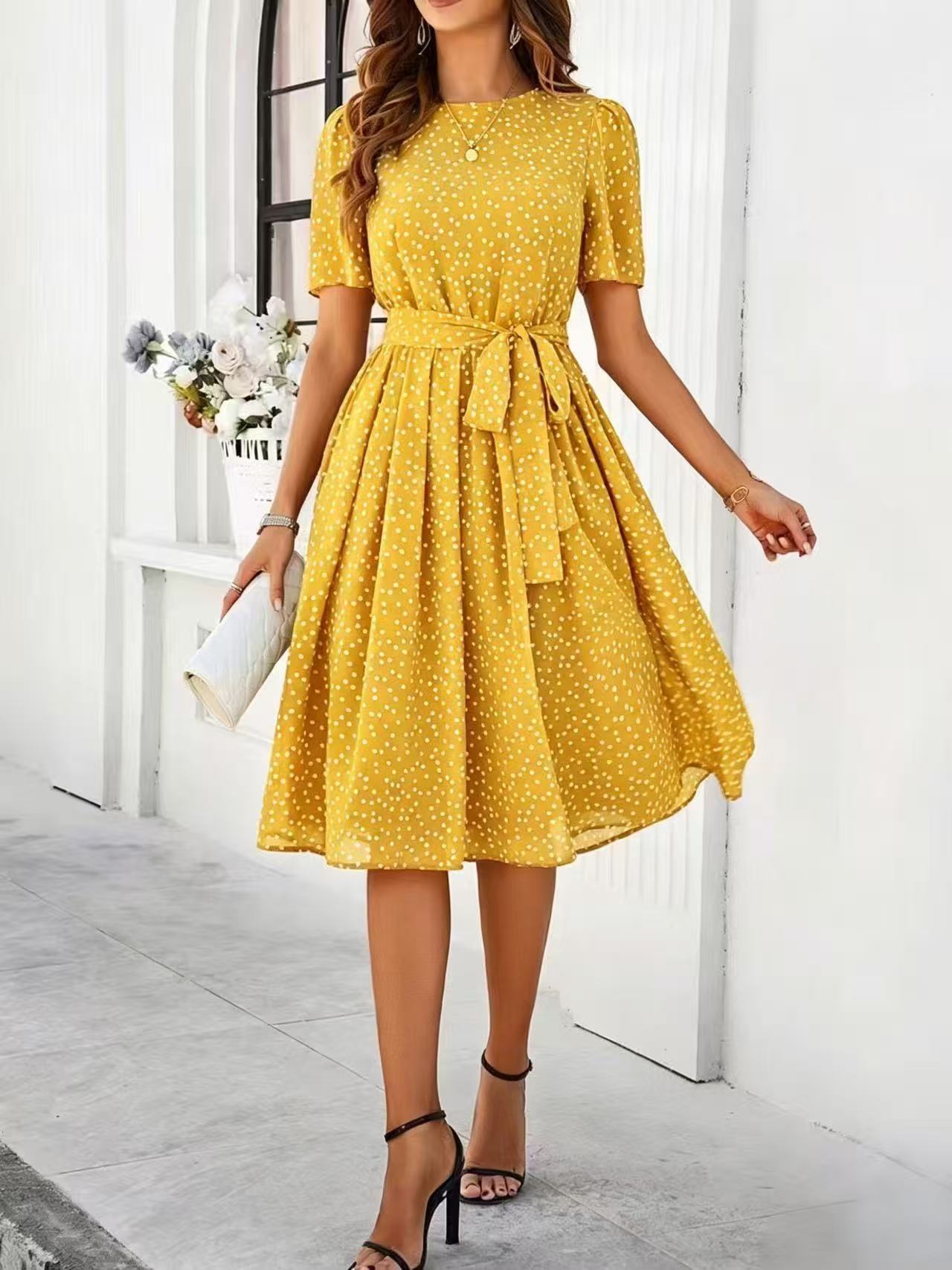 Yellow polka-dot dress with short sleeves, tie waist, and flared midi skirt