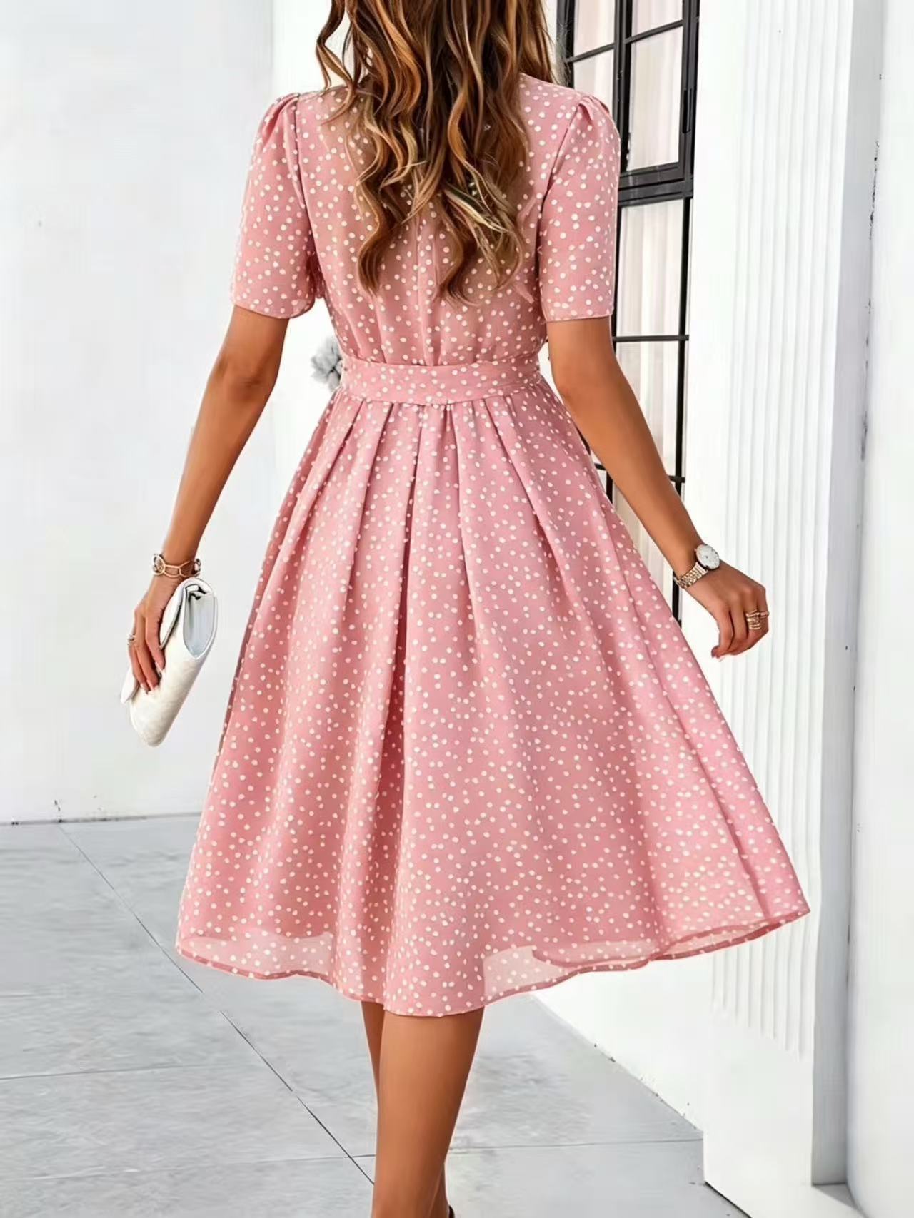 Pink polka-dot dress with short sleeves and tie waist, flared midi skirt (back view)