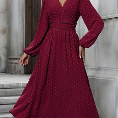 Wine red dotted pleated dress with diagonal V neckline, lantern sleeves, and split asym hem