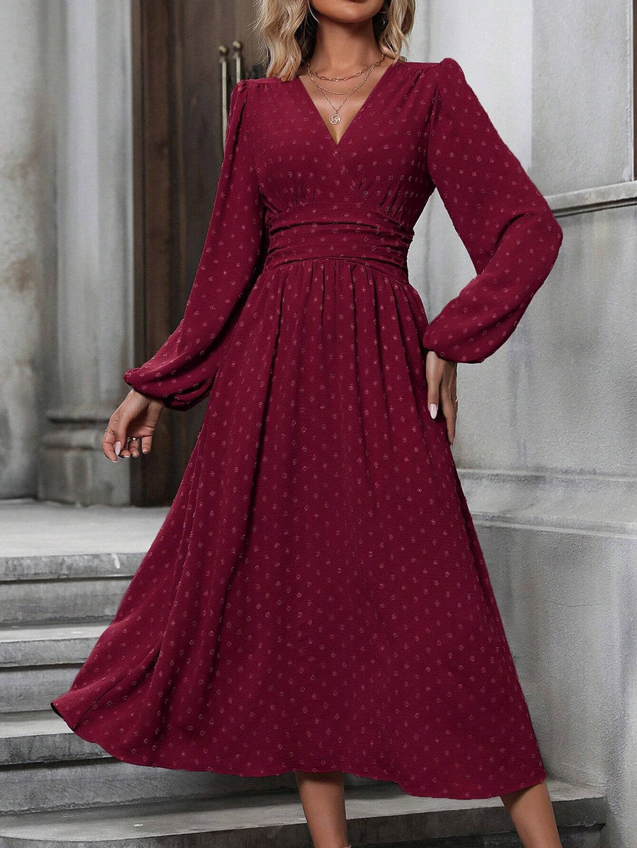 Wine red dotted pleated dress with diagonal V neckline, lantern sleeves, and split asym hem