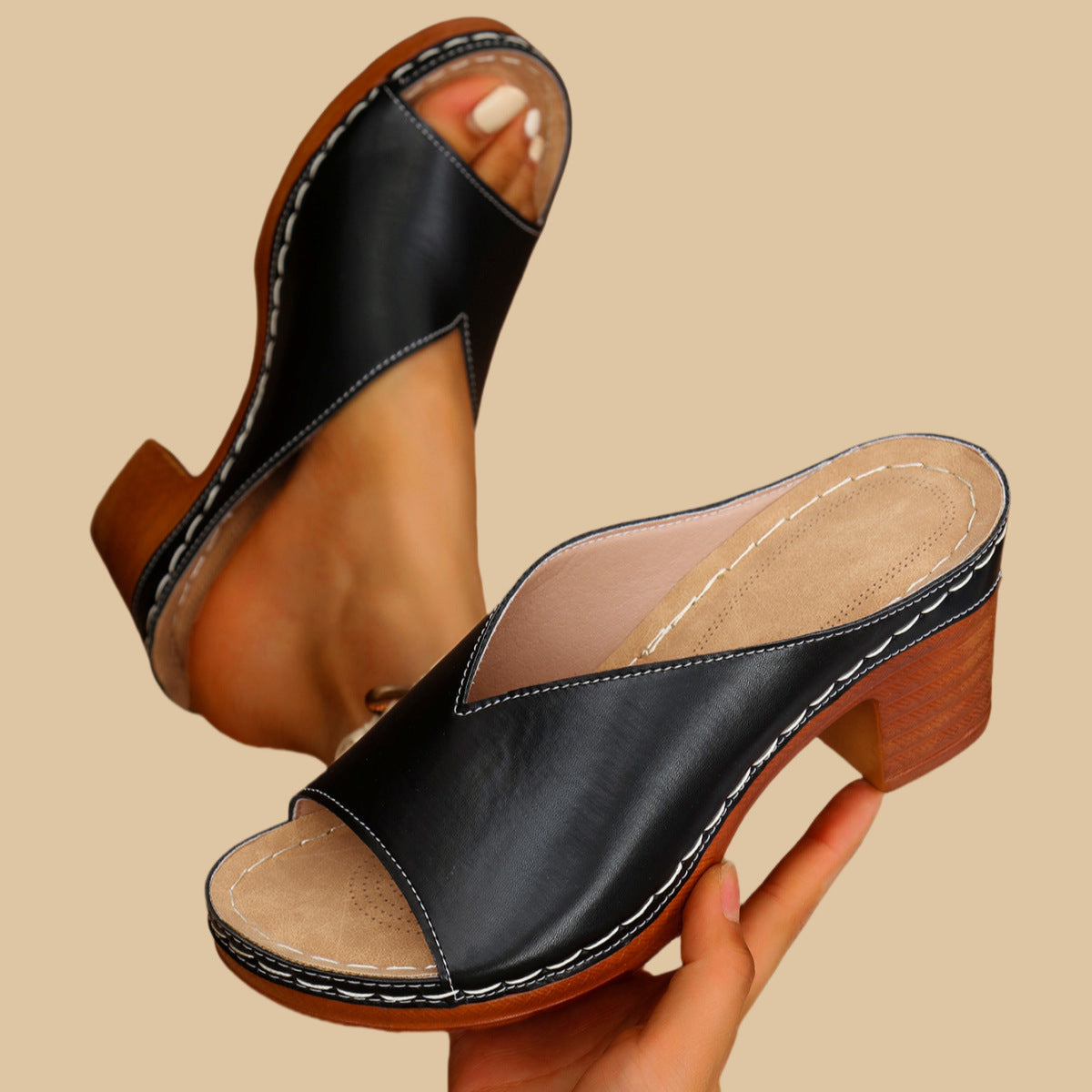 Black heeled mule sandals with open toe and side strap, wood-look block heel