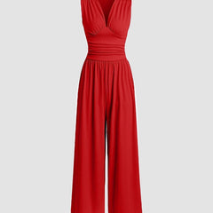 Red sleeveless wide-leg jumpsuit with V-neck, ruched bodice and gathered waist.