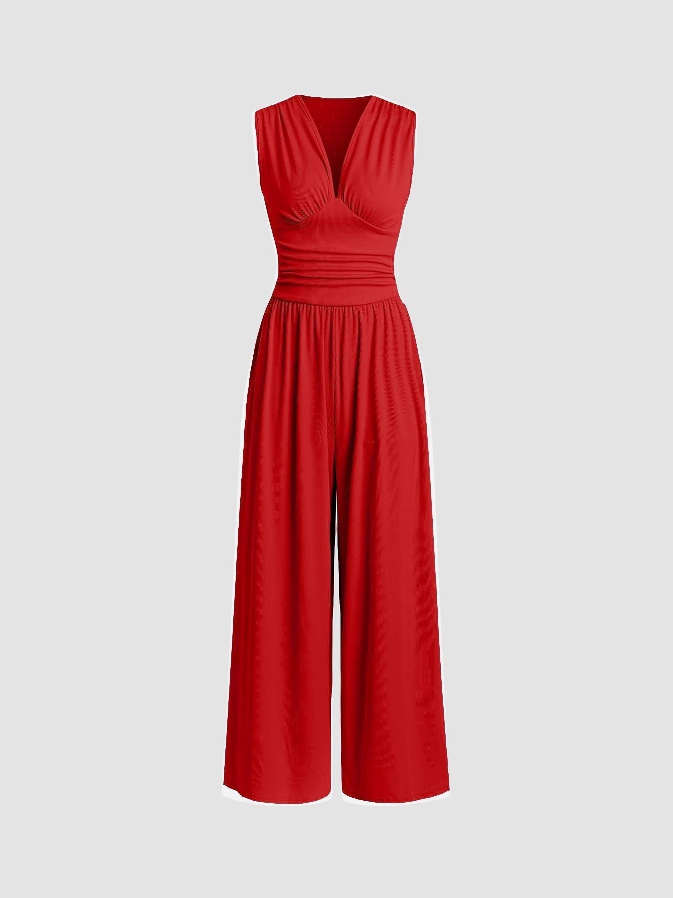 Red sleeveless wide-leg jumpsuit with V-neck, ruched bodice and gathered waist.